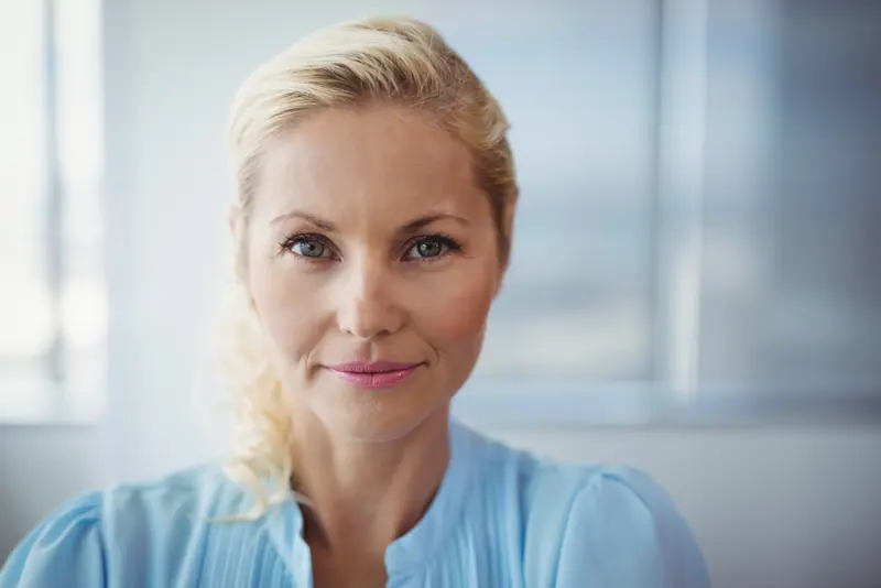 Close up of woman smiling calmly at camera