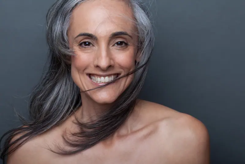 Portrait of a smiling woman with gray hair