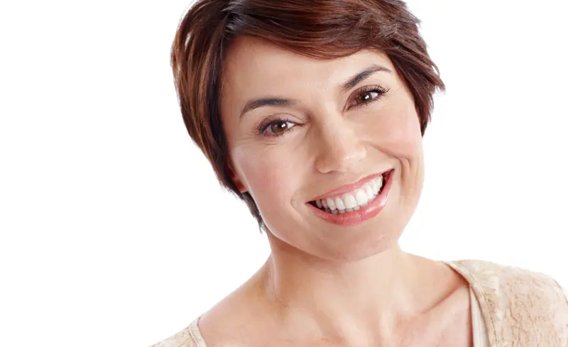 Radiant mature woman with short brown hair smiling