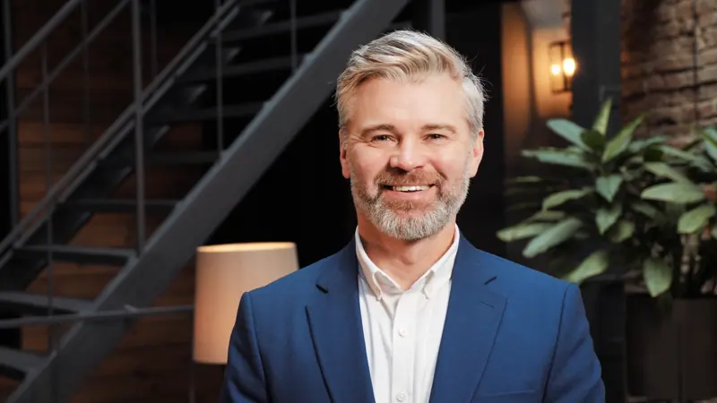 Smiling mature man in business suit portrait