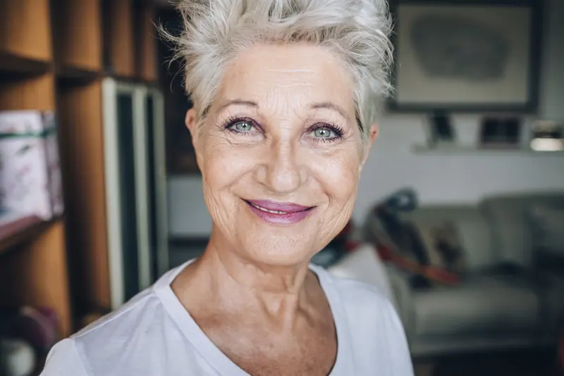 Smiling senior woman portrait with short silver ha