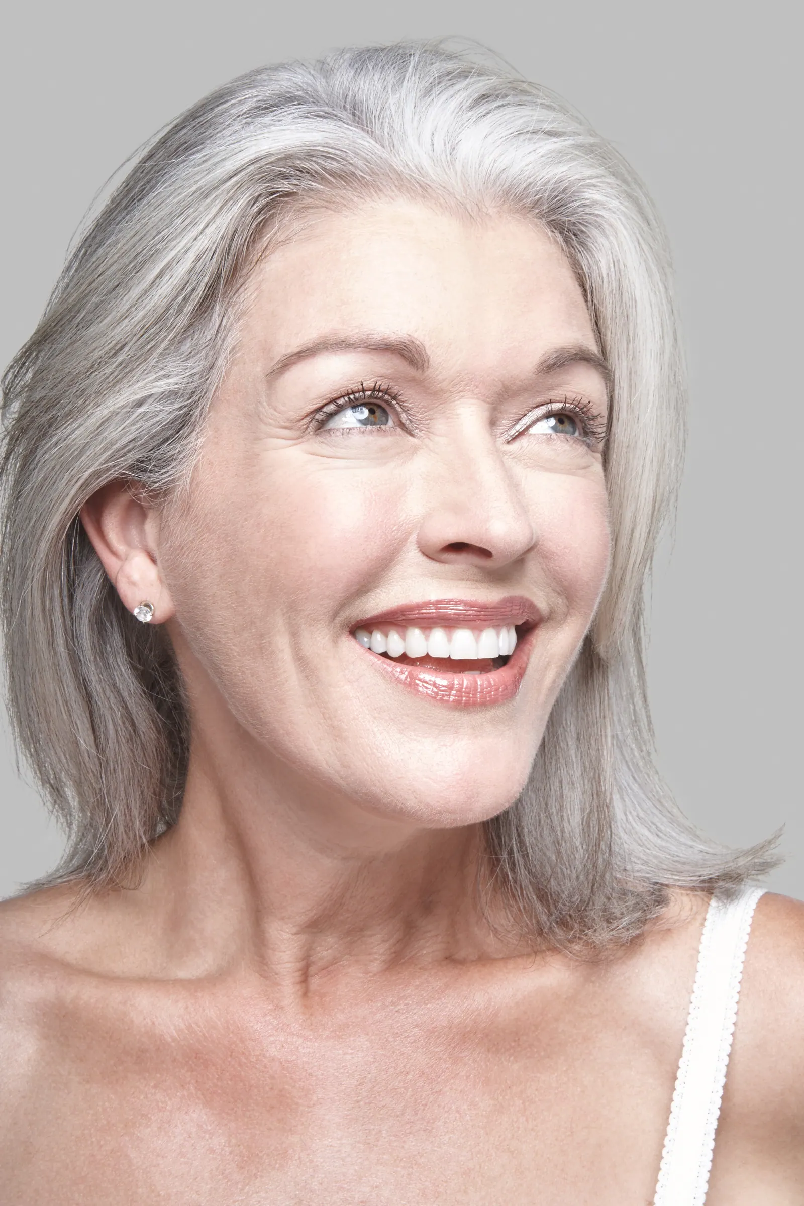 Smiling senior woman with gray hair portrait