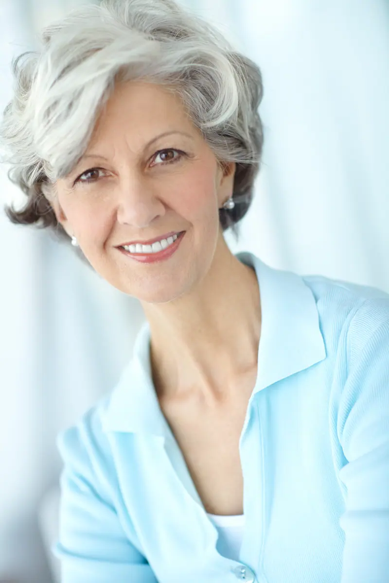 Smiling senior woman with short grey hair