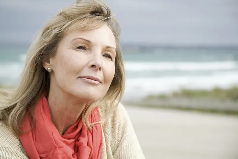 Woman enjoying ocean view at the beach